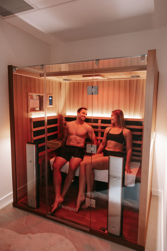 Wellness couple in a Perth full spectrum sauna experiencing detox and deep relaxation.